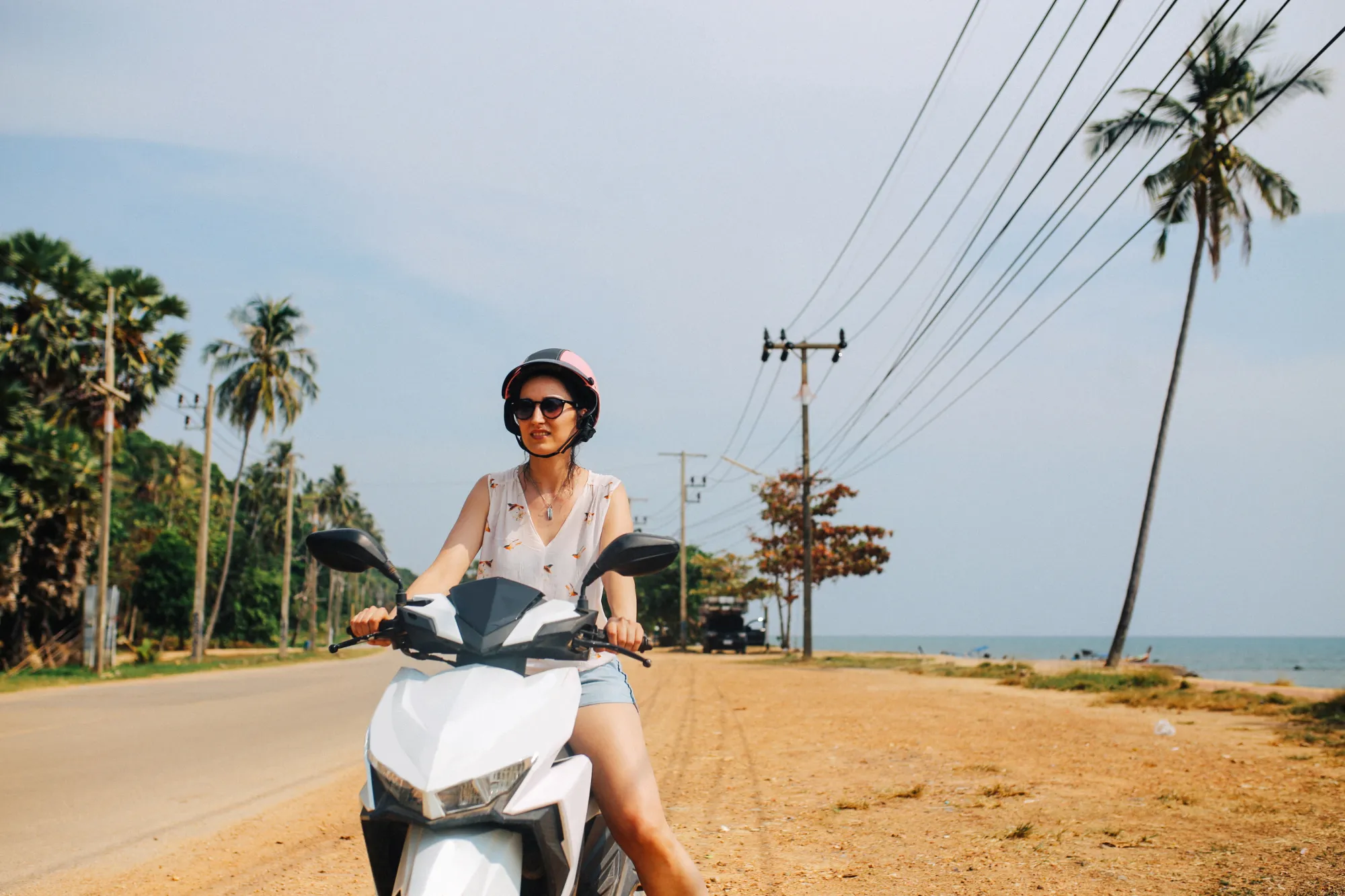 Image of a woman on a scooter in Koh Lanta, Thailand