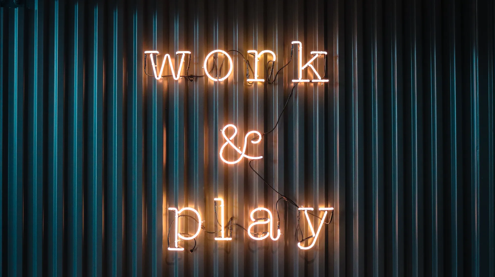 Image of a sign saying "work and play"