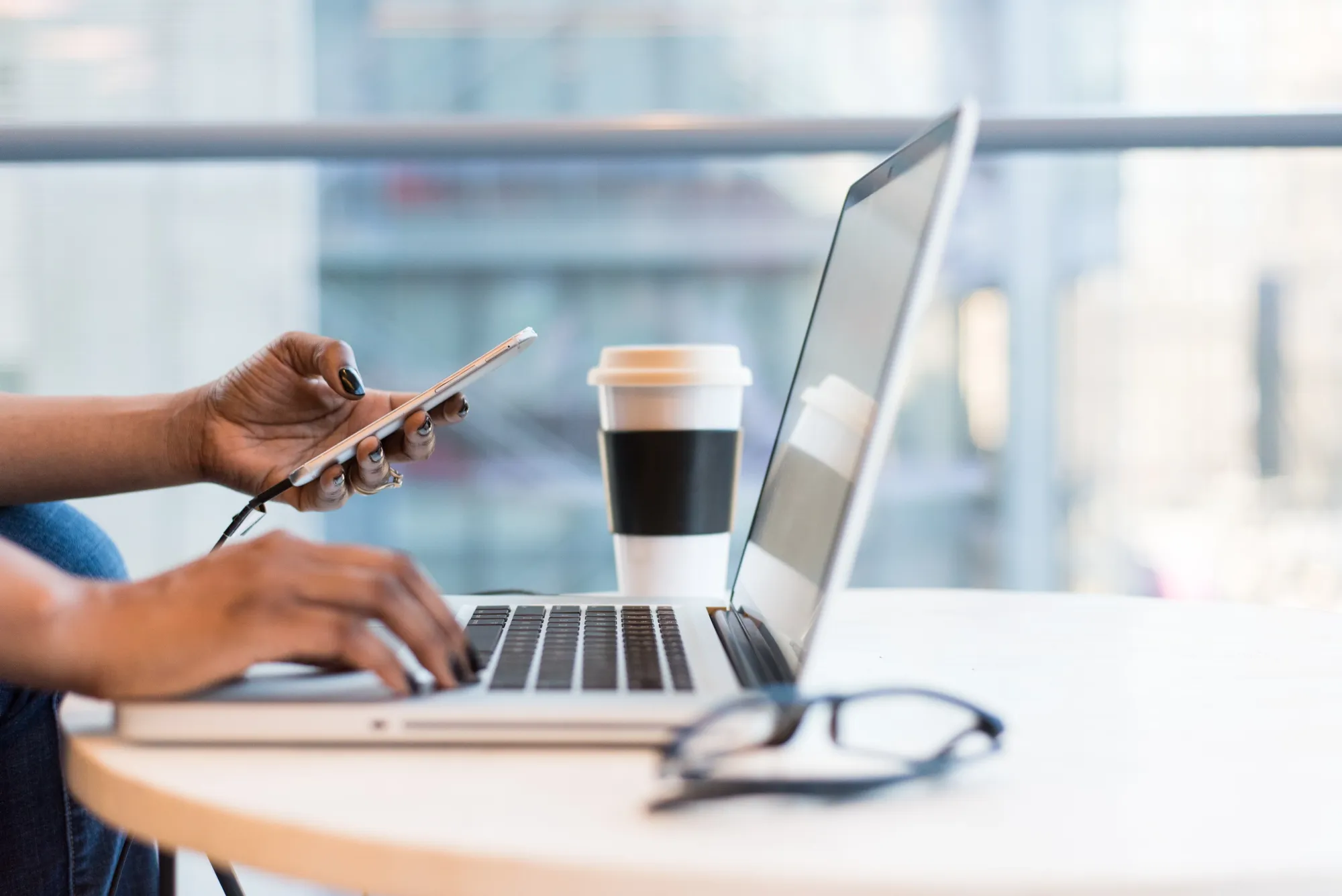 Image of a woman workign remotely form her laptop