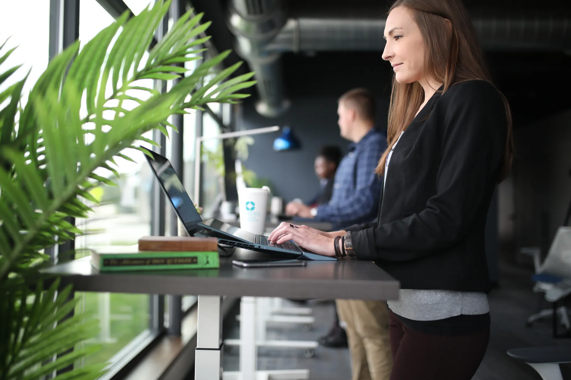 Image of a woman using a standing desk