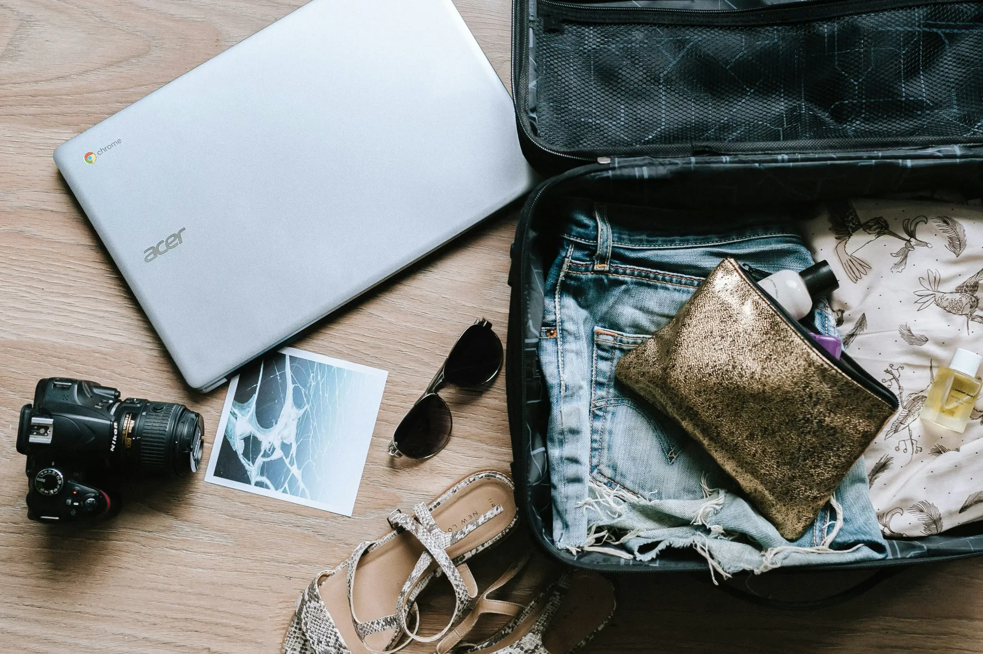 Digital nomad packing tech essentials including travel cameras