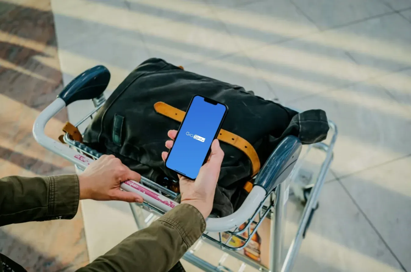 a person trying to setup an esim on iphone outside the airport