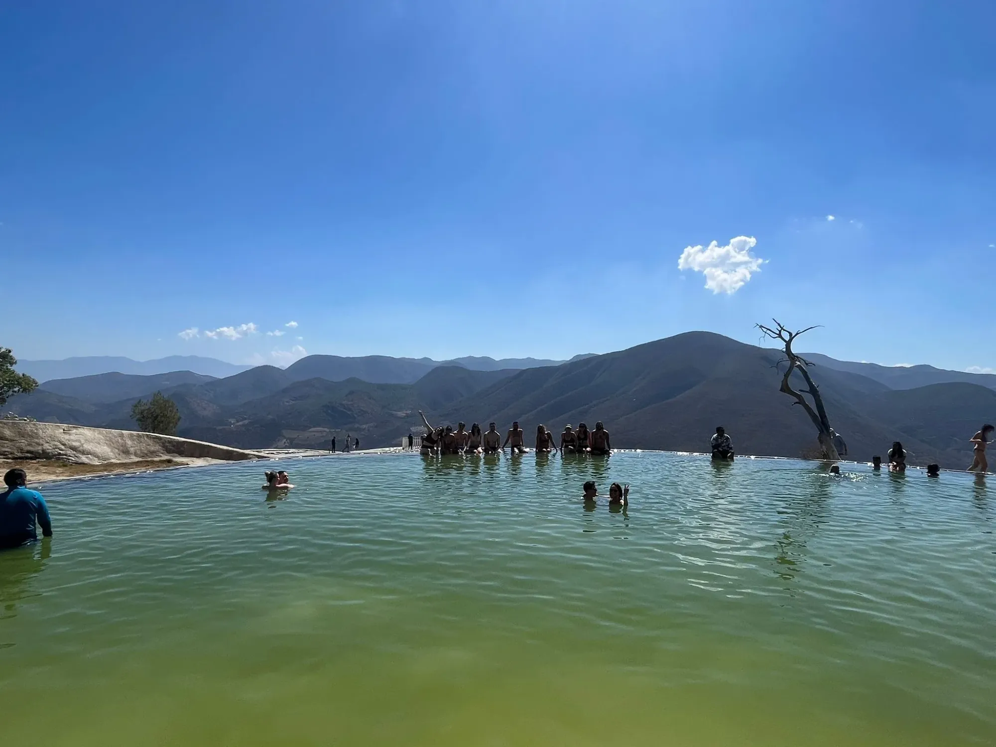 Digital nomads from around the globe soaking up the vibes (and stunning turquoise pools!) of Hierve El Agua, Oaxaca.