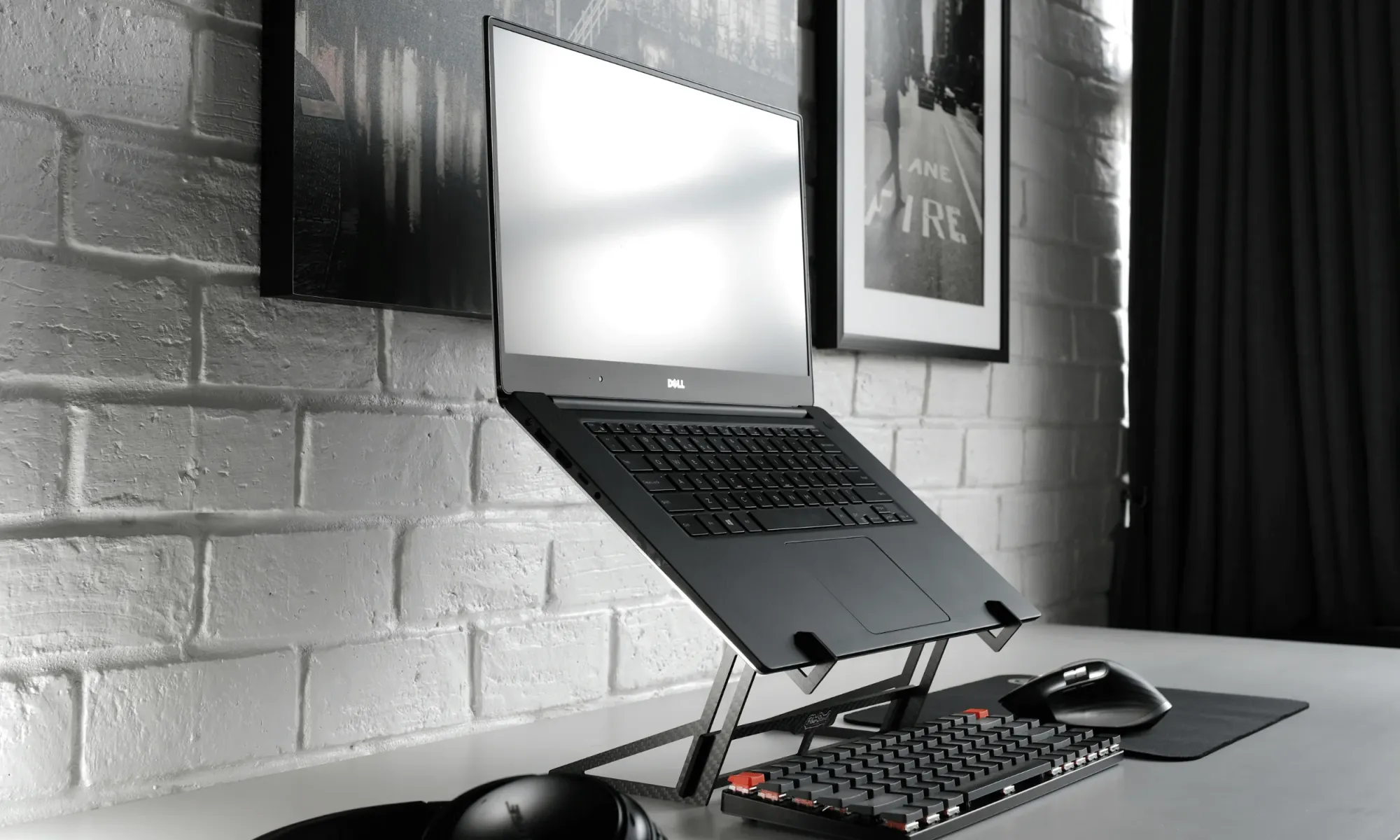 Portable and travel-friendly laptop stand on a grey desk