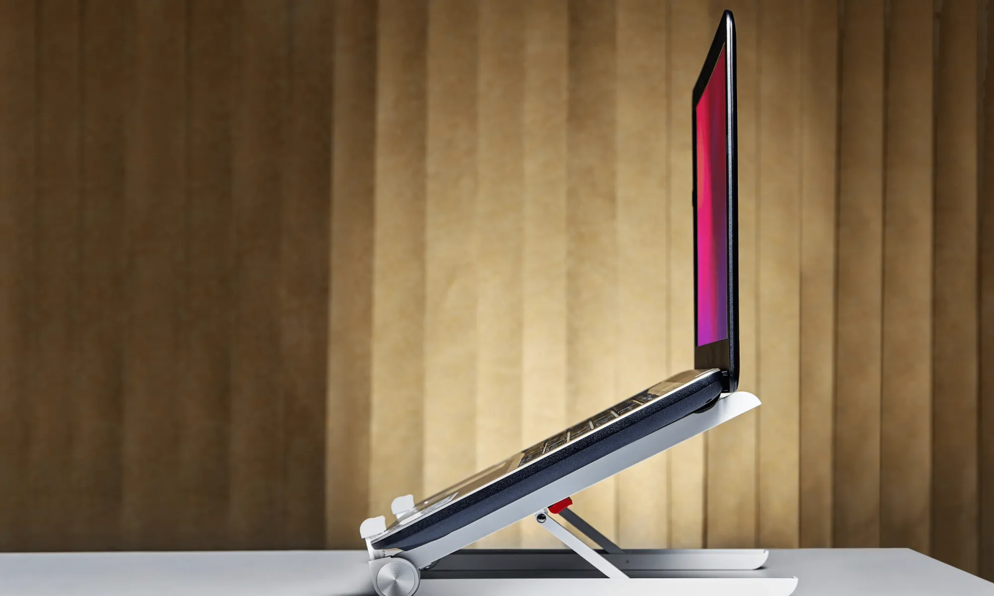 Portable and travel-friendly laptop stand with wooden background