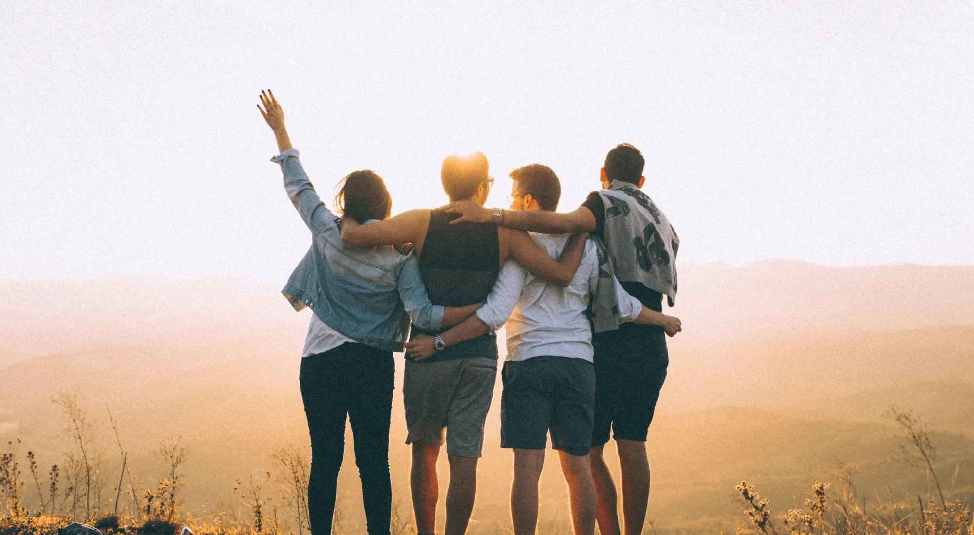 Group of friends outdoor at sunset