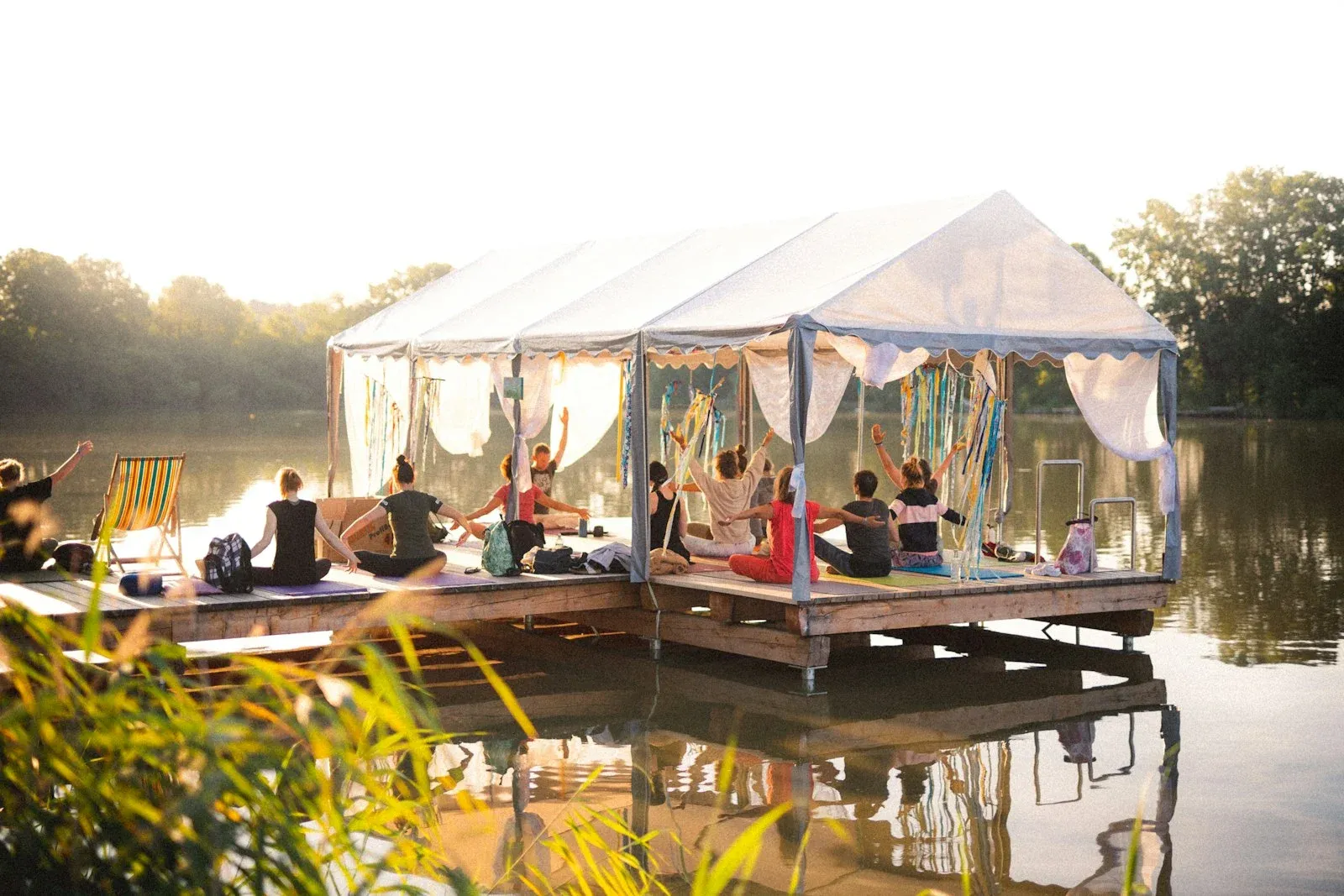 Group of people practicing yoga outside