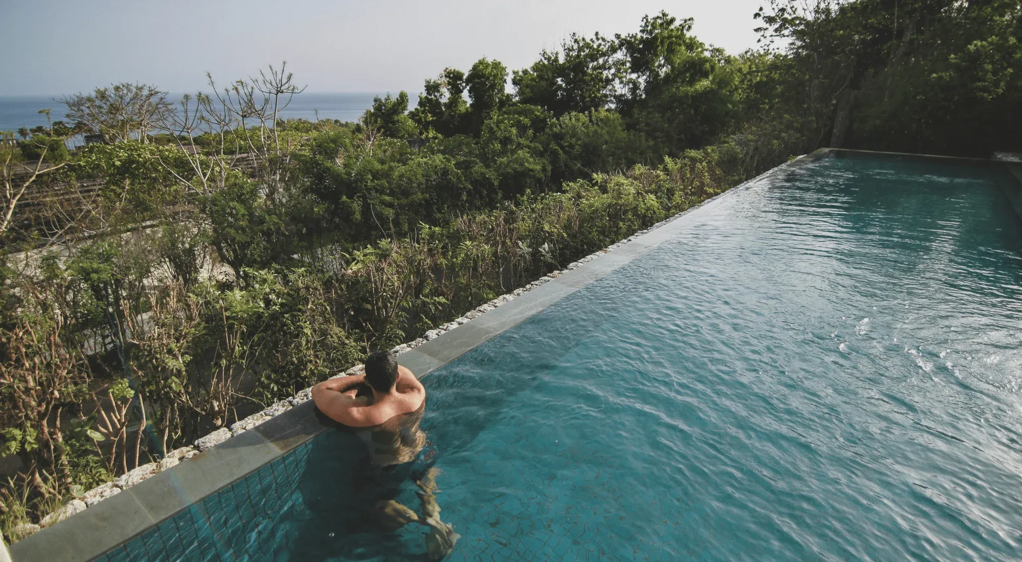 Digital nomad in a pool in Bali