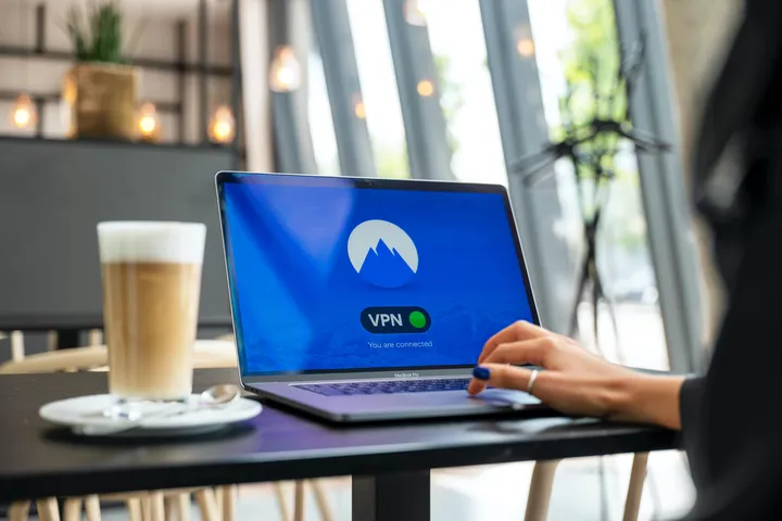 remote worker using a VPN from a cafè