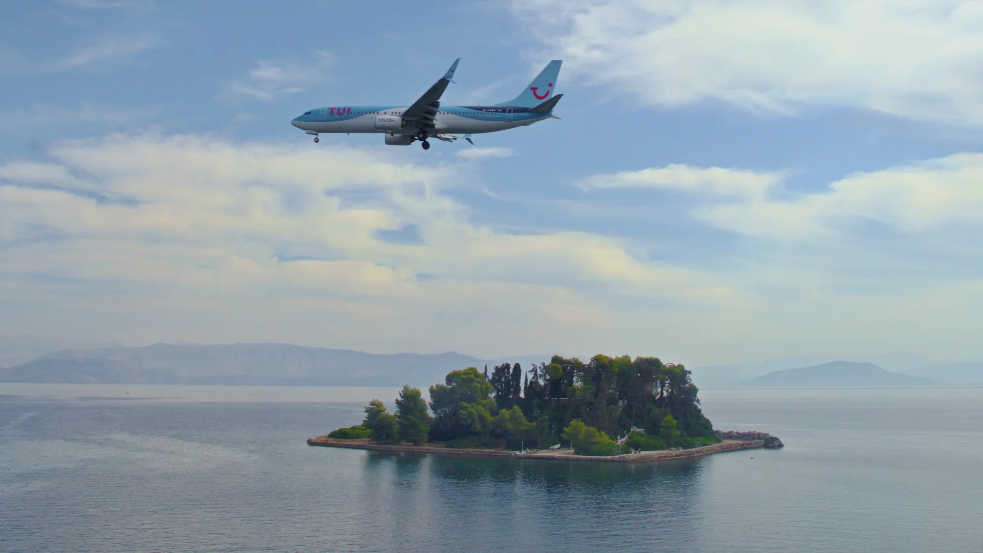 Airplane flying over Corfu, Greece